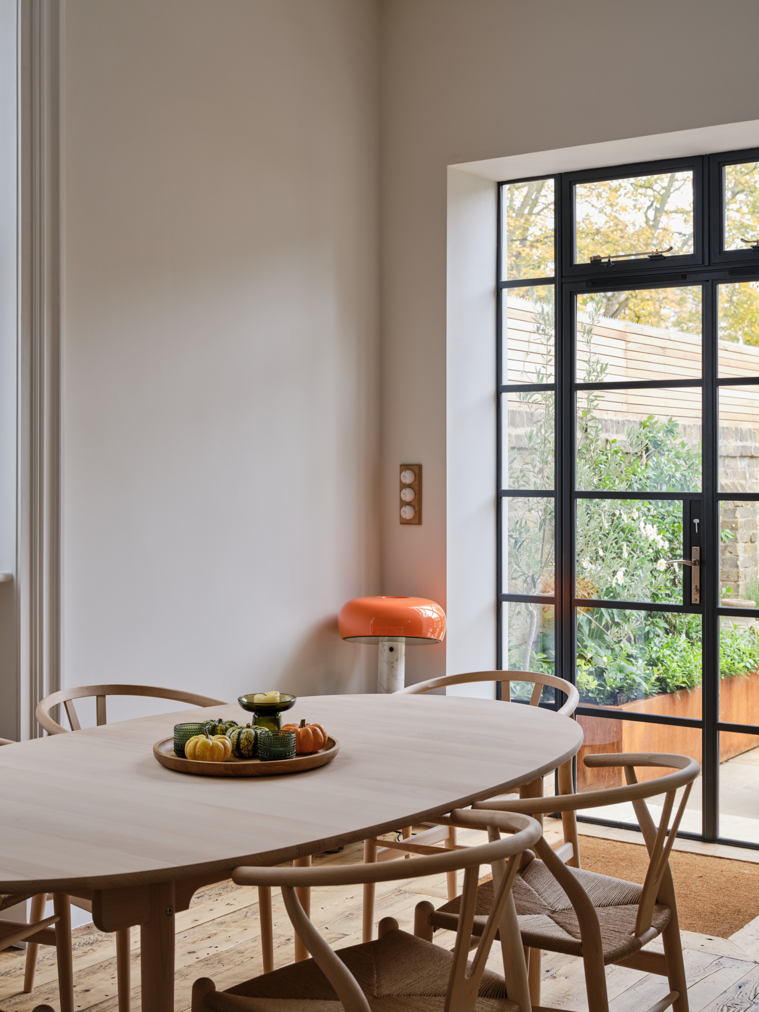 Contemporary kitchen with lime-green range cooker and vibrant pastel finishes